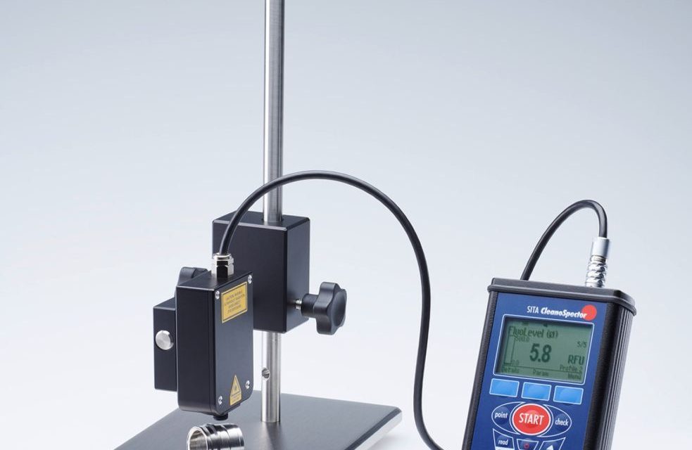 Hand-held test instrument for metal cleanliness
