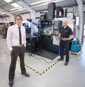 Jason Aldridge left MD of ASG Arrowsmith marking SC21 Silver Award