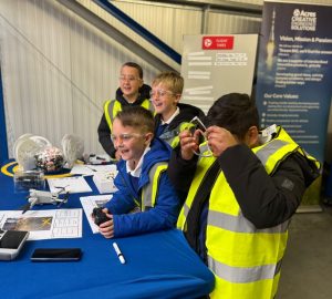 Luke and Alice Parker from Acres Engineering with students at National Manufacturing Day